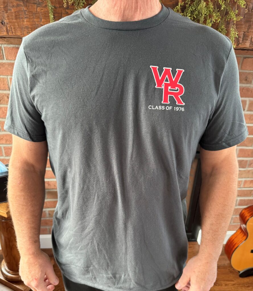 WRHS '76 T-shirt Model is 5'8" and weighs 180 lbs. He is wearing a LARGE t-shirt